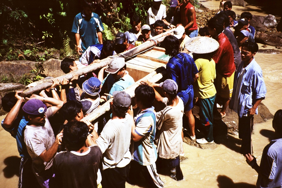 Villagers in Long Lawen, Sarawak, Malaysia install a micro-hydro system to generate electricity rewnewably