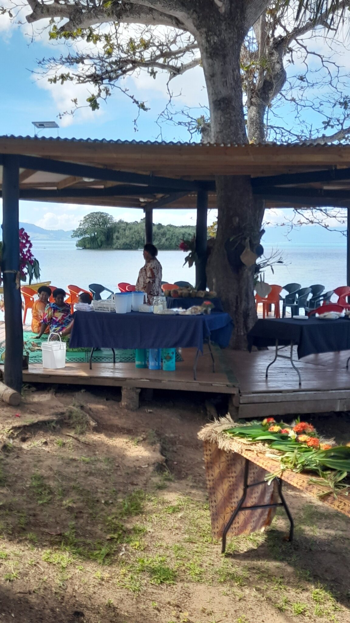Table set for event on beach under new canopy structure