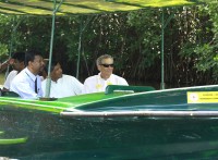 Duane Silverstein (right) and Anuradha Wickramasinghe (second from right) with a government agent of Puttlam District tour conserved mangrove Forest in Pambala-Chilaw lagoon on 10th May 2015 in Sri Lanka