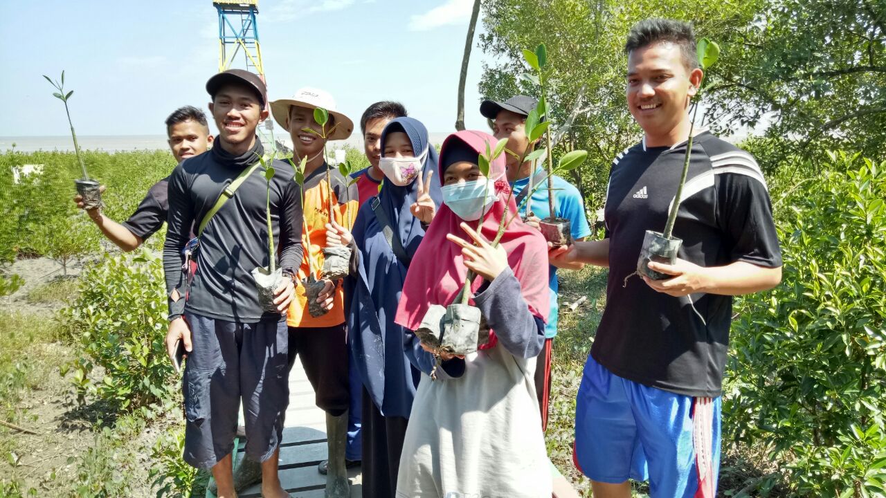 Students at Setapuk Besar mangrove area, Indonesia