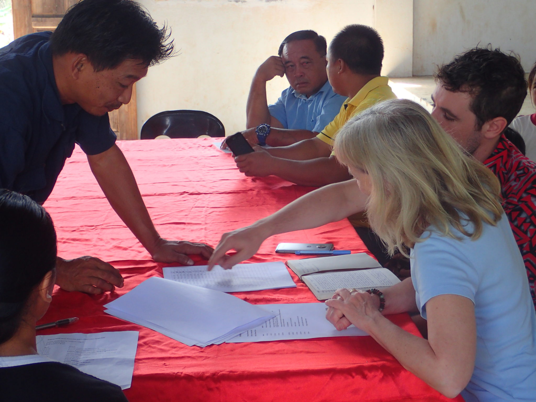 Villagers in Sabah, Malaysia discussing forest protection agreement with Seacology representatives