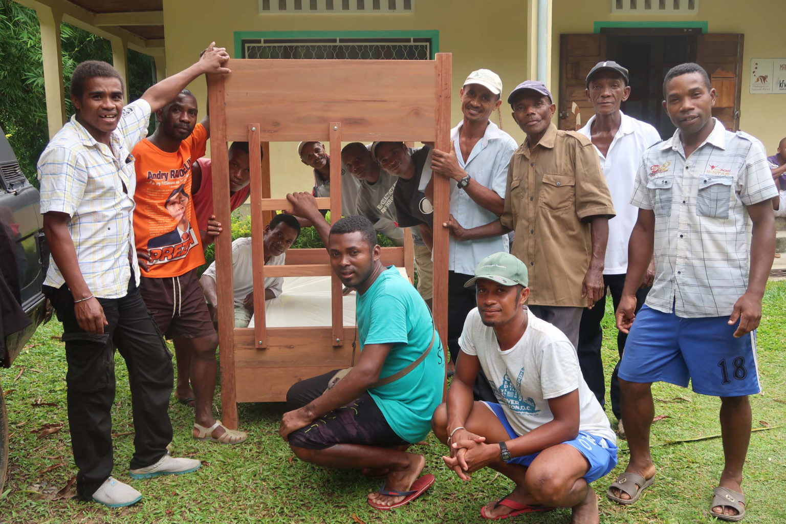 Men Installing beds in tourist bungalows near Marojejy National Park, Madagascar