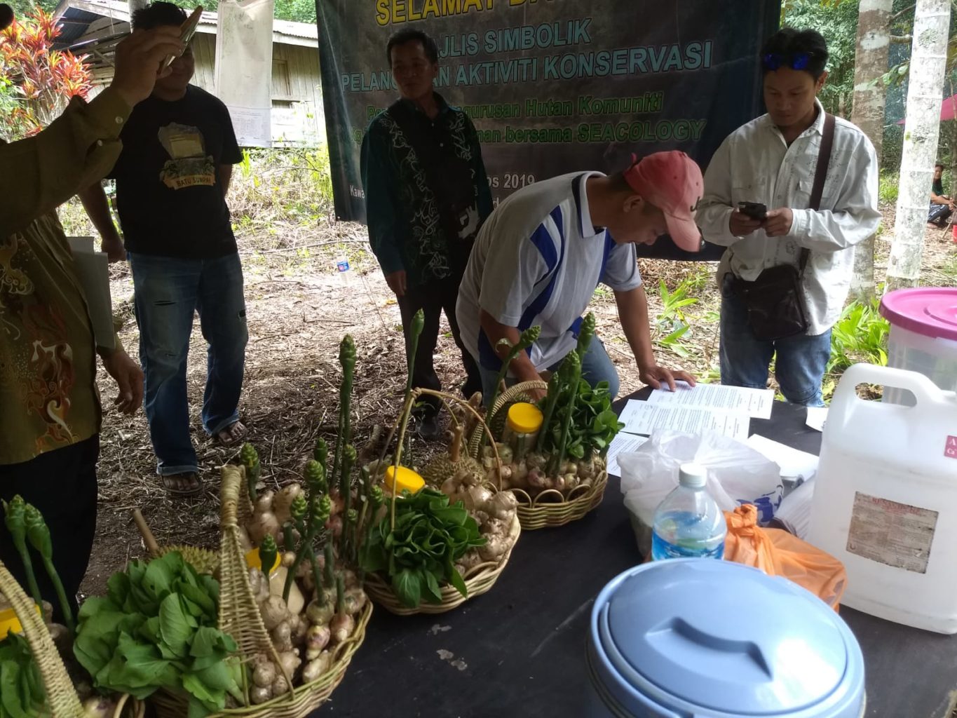 Villagers in Tiga Bundu, Malaysia sign a conservation agreement with environmental organization Seacology