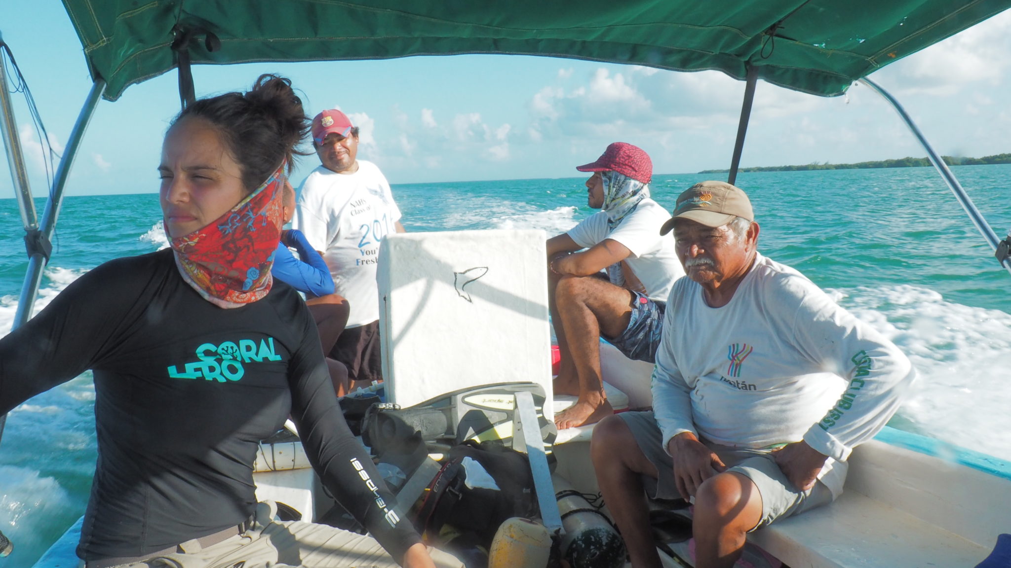 Fishermen and a representative from Coral Hero in a boat at Cayo Alcatraz