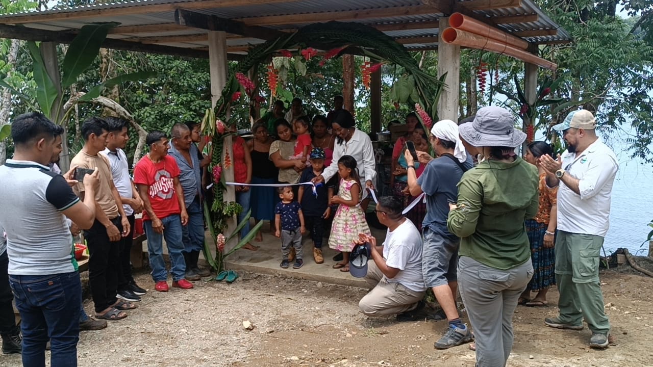 A group of people at a ribbon cutting ceremony