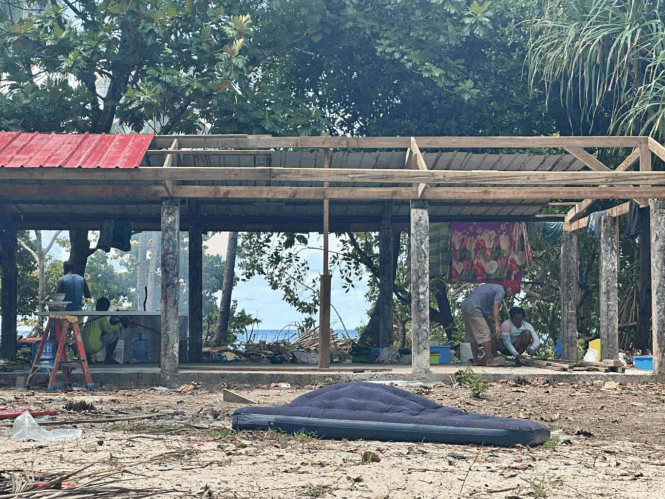 building under construction with exposed frame and partially completed roof