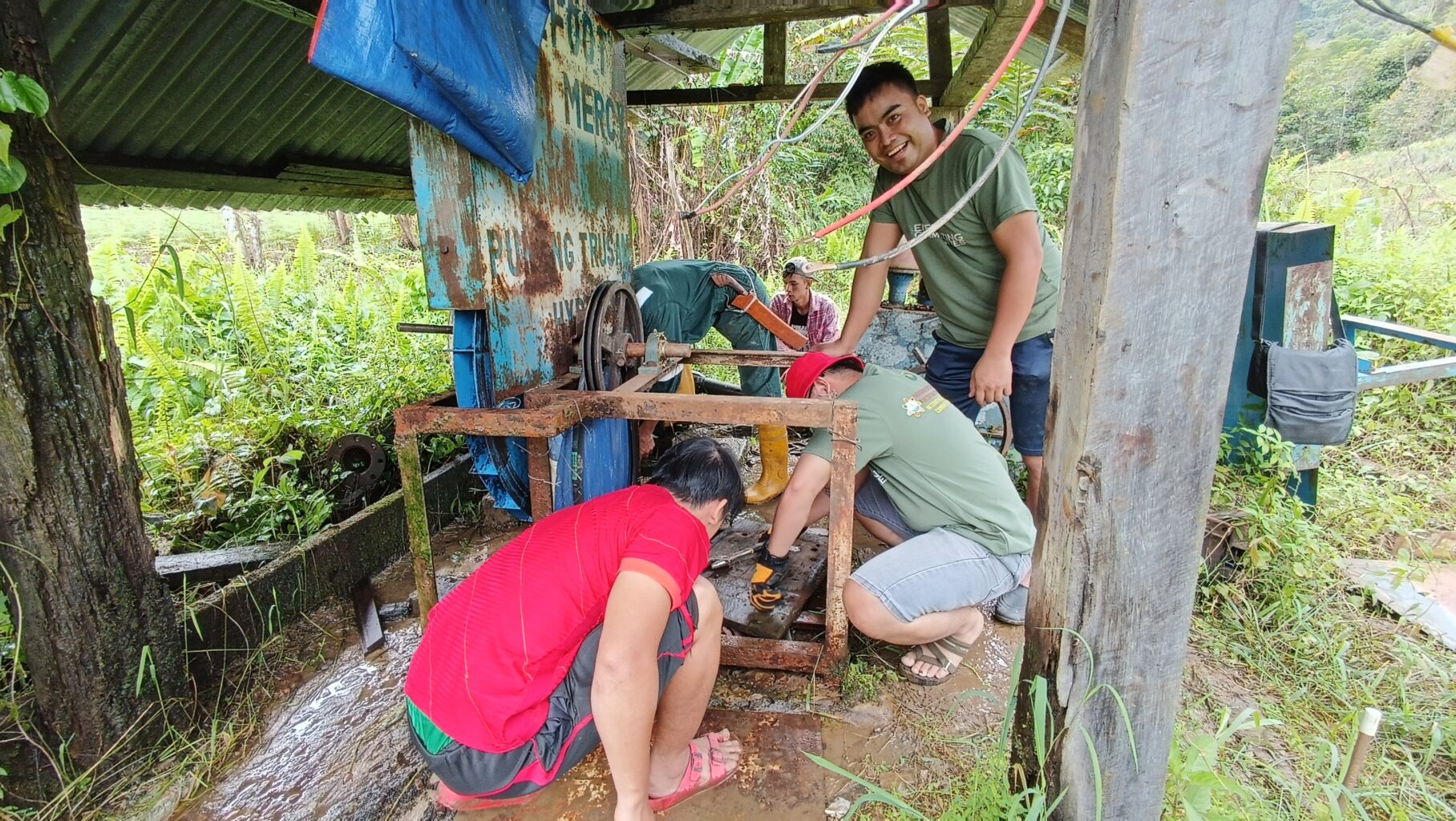 Villagers install the micro-hydro turbine.