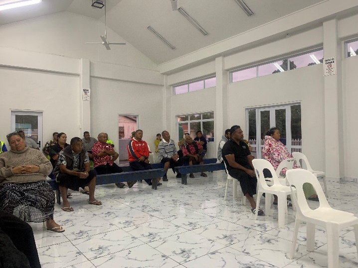 A group of people listens to a presentation