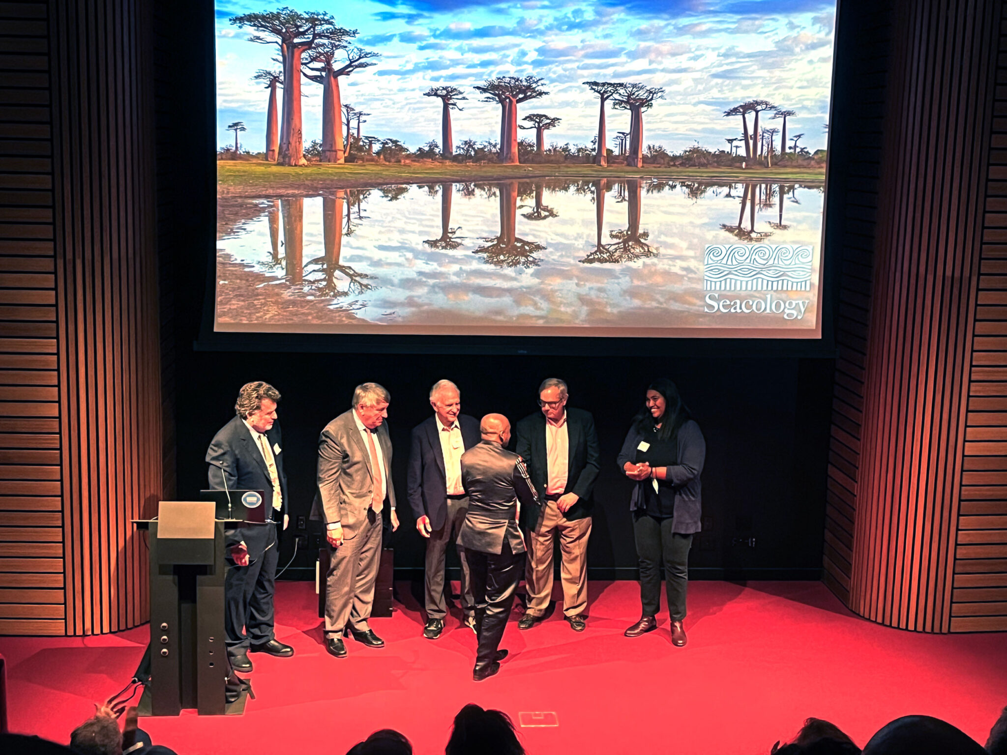 Members of our board of directors present the Seacology Prize to Dr. Jonah Ratsimbazafy.