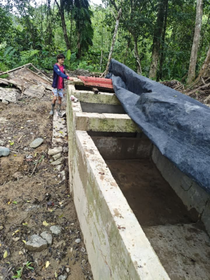 New concrete spillway structure in forest