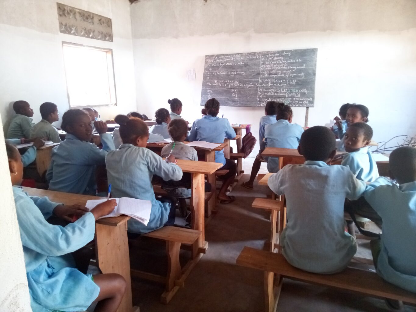 Classroom full of young students, seen from behind
