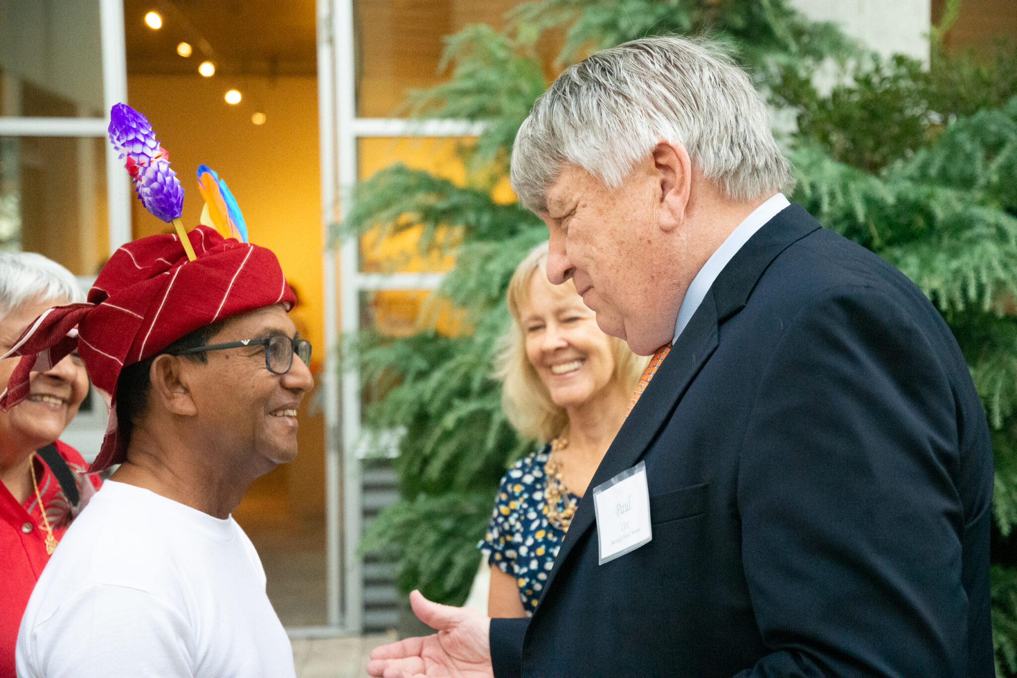 Profile shot of two men speaking