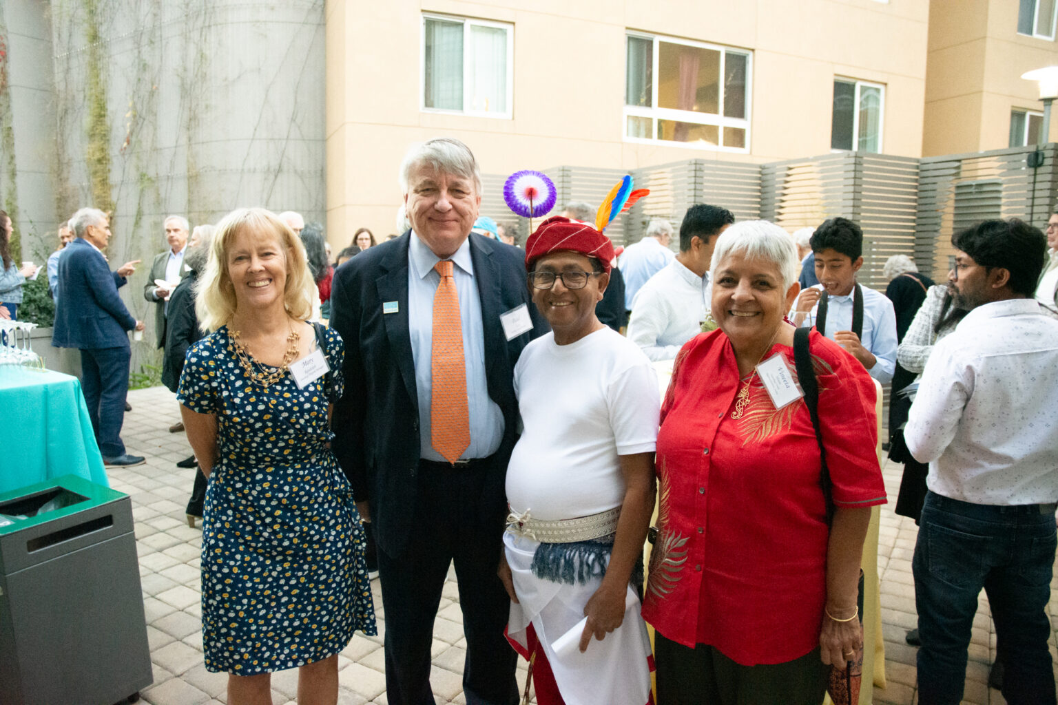 Four people smile for the camera