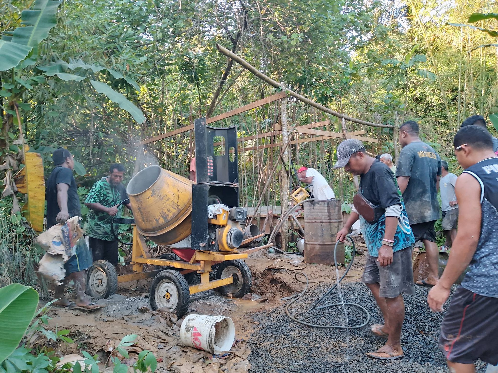 Construction crew lays gravel for foundation