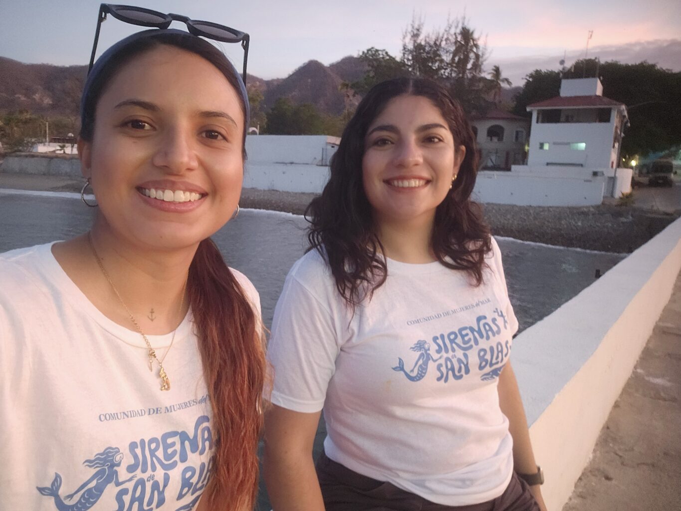 Two women smiling at the camera