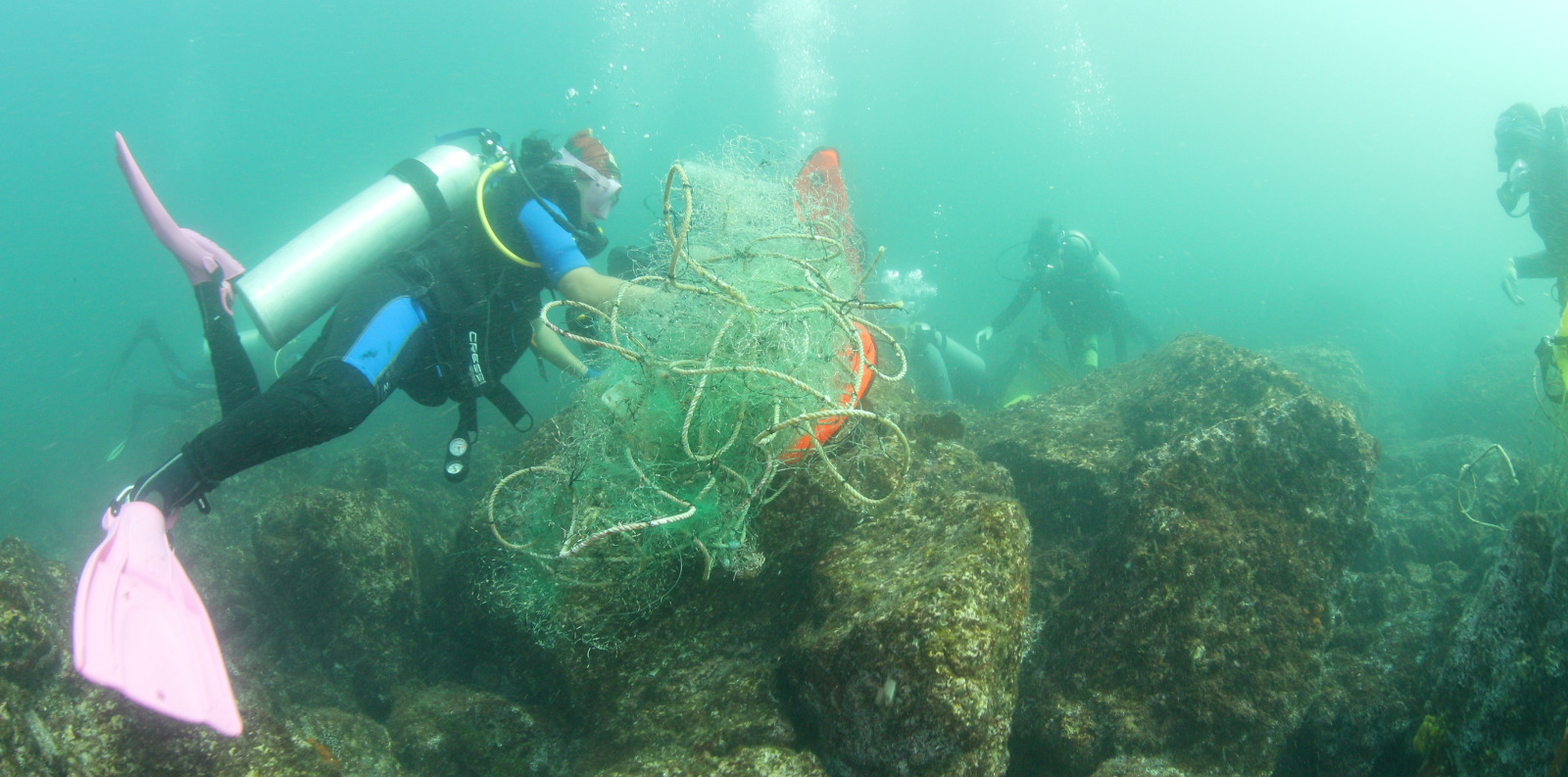 Diver picking up submerged gear