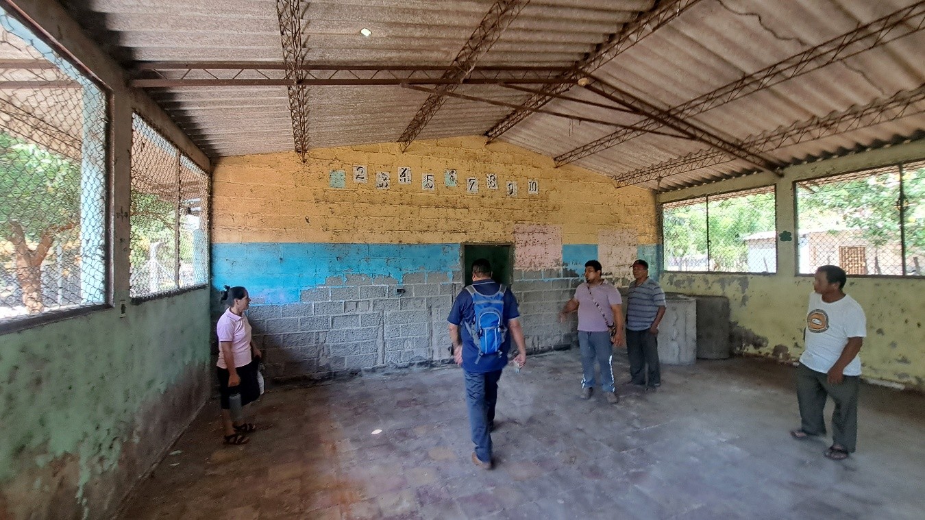 People in run-down community center