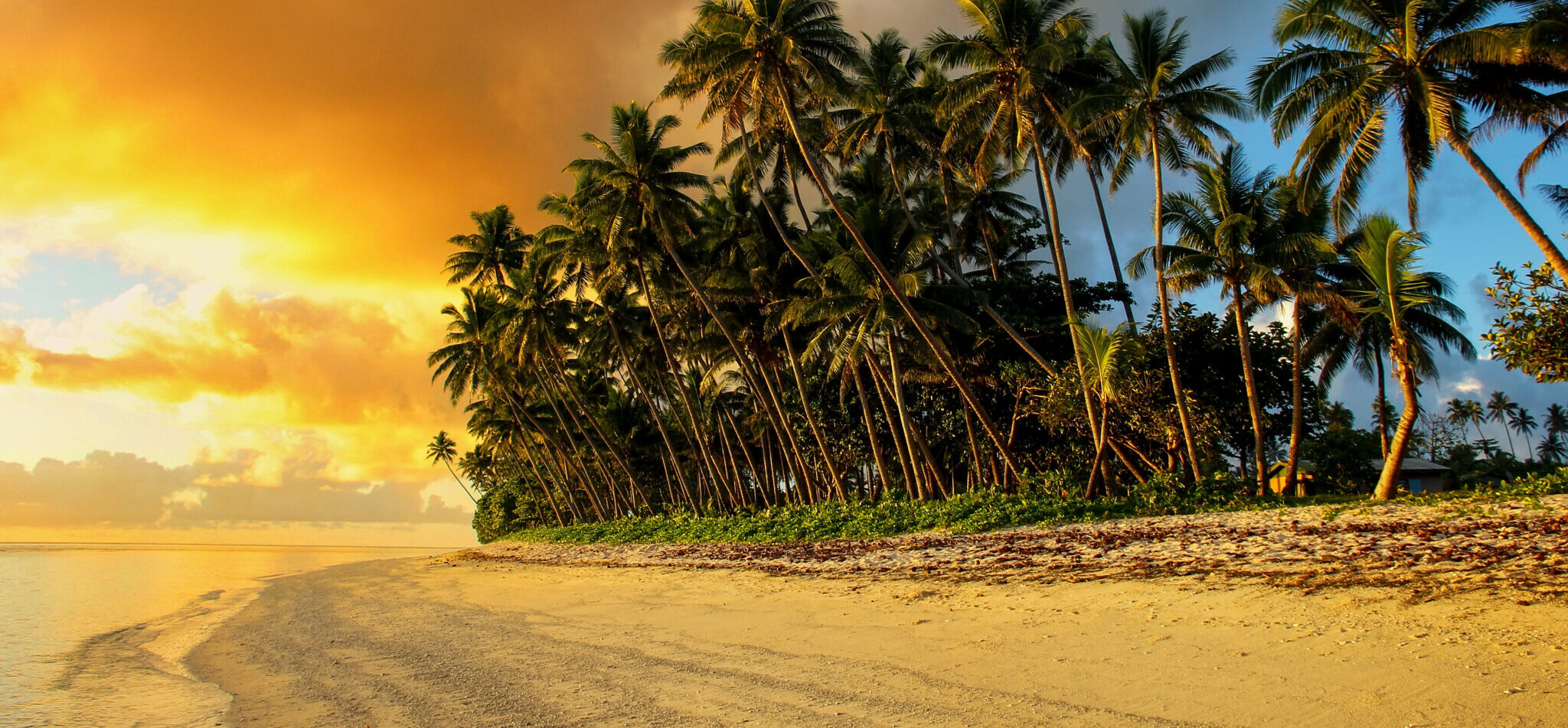 Colorful sunrise on the beach in Lavena village on Taveuni Island, Fiji. Taveuni is the third largest island in Fiji.